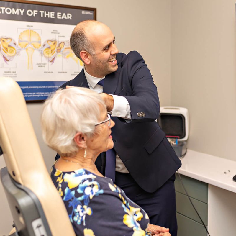 audiologist conducting a hearing test